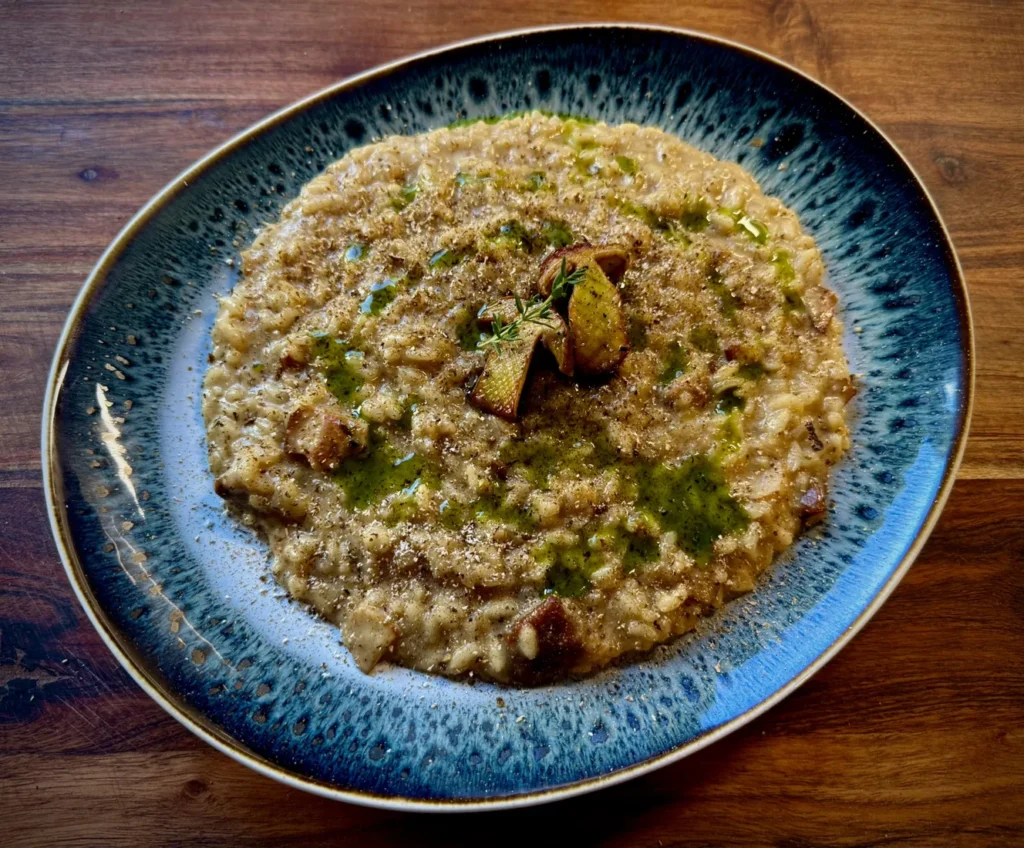 Risotto ai porcini, olio all’aneto e polvere di funghi